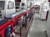 Live roller conveyor line for eye contact lens - side view