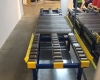 Gravity roller conveyor for wooden pallets - with pallet separator - and oil retention tray